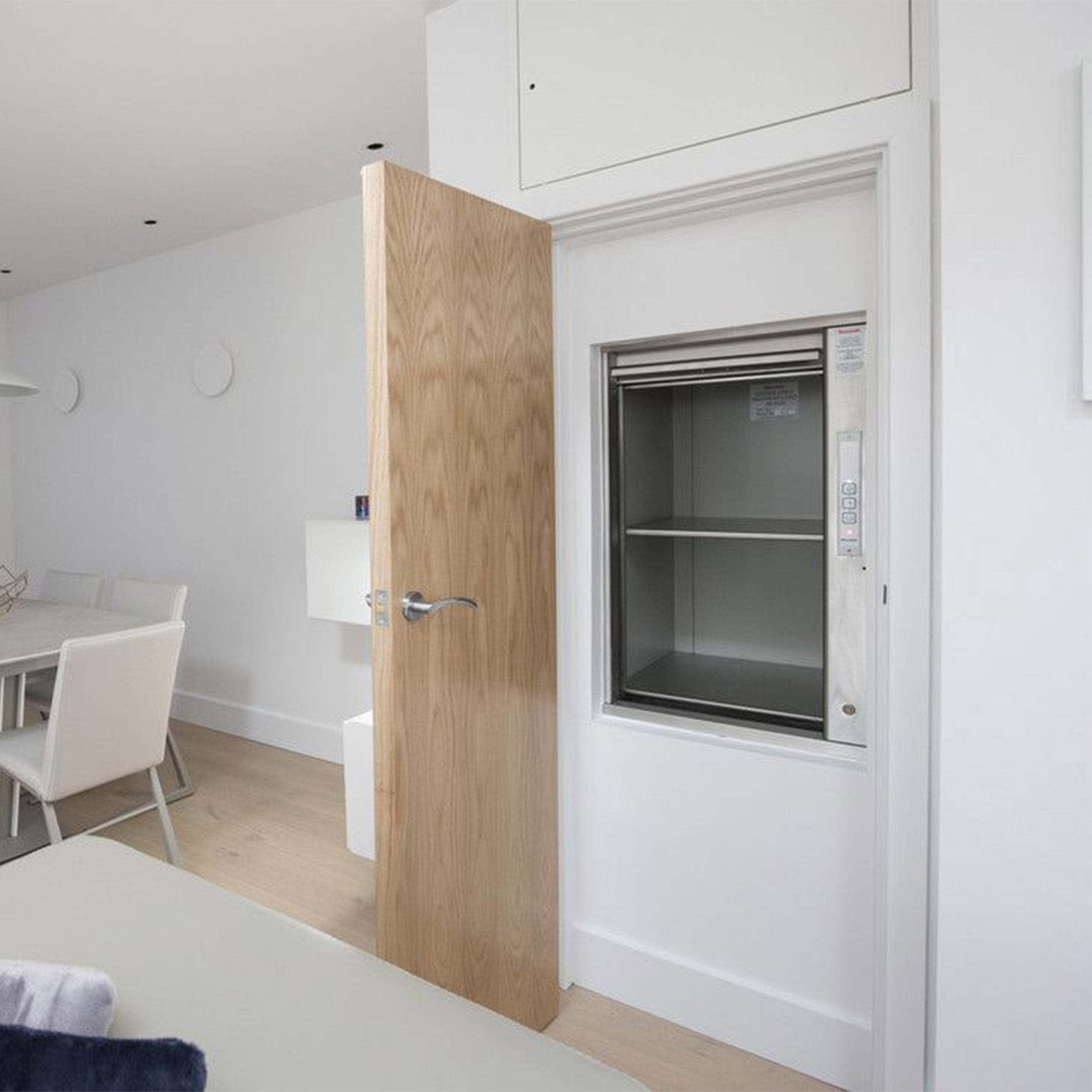 Home dumbwaiter beside a dining table
